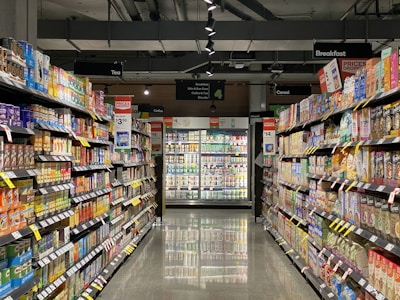 Retail grocery aisle stocked with frozen and refrigerated products
